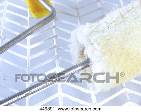 Stock Image - Close-up of paint roller . Fotosearch