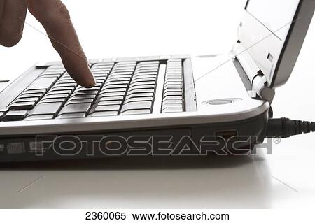 Close-up of person's hand using laptop View Large Photo Image Stock Photography - Close-up of person's hand using laptop . Fotosearch
