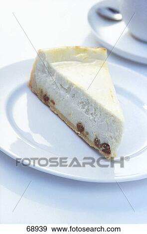 Stock Photo - Close-up of piece of cheesecake on plate . Fotosearch