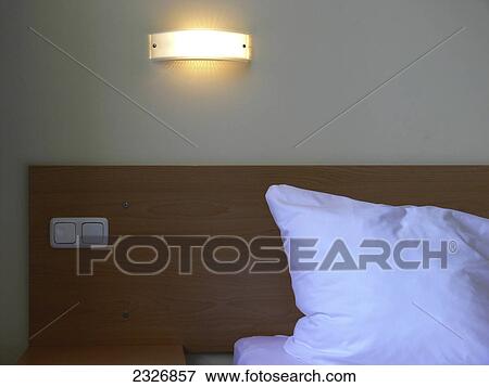 Close-up of pillow and switch plate in hotel room View Large Photo Image Stock Photo - Close-up of pillow and switch plate in hotel room . Fotosearch