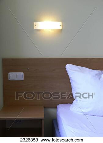Close-up of pillow and switch plate in hotel room View Large Photo Image Stock Photo - Close-up of pillow and switch plate in hotel room . Fotosearch