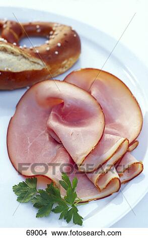 Picture - Close-up of prosciutto and parsley on plate . Fotosearch