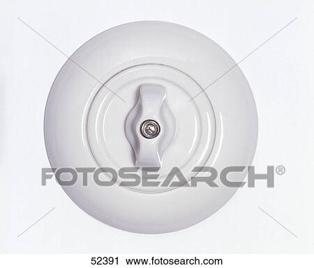 Stock Image - Close-up of rotary electric switch . Fotosearch