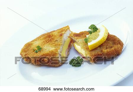 Close-up of schnitzel and slice of lemon on plate View Large Photo Image Picture - Close-up of schnitzel and slice of lemon on plate . Fotosearch
