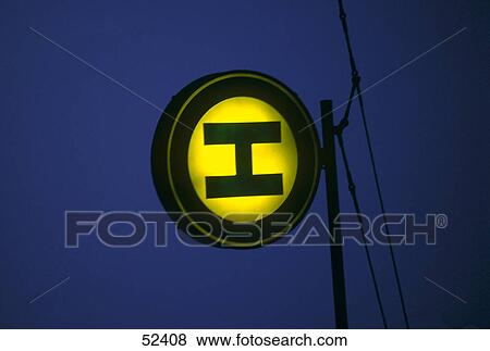 Stock Photo - Close-up of sign of bus stop illuminated at night . Fotosearch