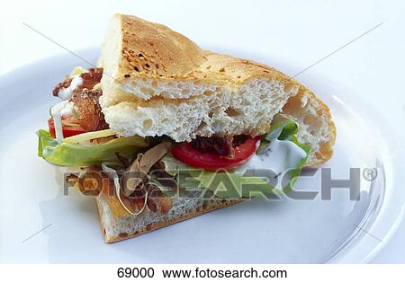 Close-up of slice of burger on plate View Large Photo Image Stock Image - Close-up of slice of burger on plate . Fotosearch