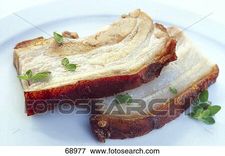Stock Photo - Close-up of slices of roast pork . Fotosearch
