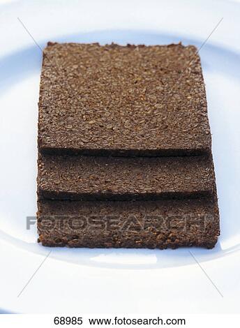 Stock Photography - Close-up of slices of wholewheat bread . Fotosearch