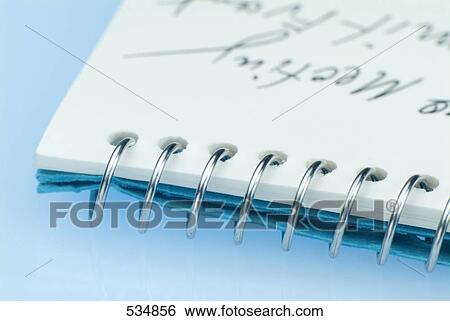 Stock Photograph - Close-up of spiral notebook . Fotosearch