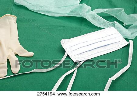 Picture - Close-up of surgical mask and glove . Fotosearch