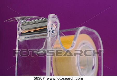Close-up of tape dispenser View Large Photo Image Stock Photo - Close-up of tape dispenser . Fotosearch