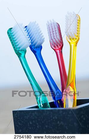 Close-up of toothbrushes in holder  View Large Photo Image Stock Image - Close-up of toothbrushes in holder . Fotosearch