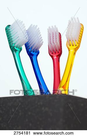 Close-up of toothbrushes in holder View Large Photo Image Stock Image - Close-up of toothbrushes in holder . Fotosearch