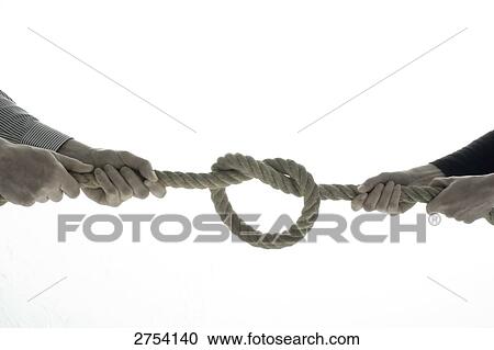 Close-up of two men pulling rope View Large Photo Image Stock Image - Close-up of two men pulling rope . Fotosearch