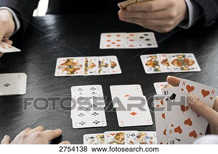 Close-up of two people playing cards View Large Photo Image Stock Photo - Close-up of two people playing cards . Fotosearch
