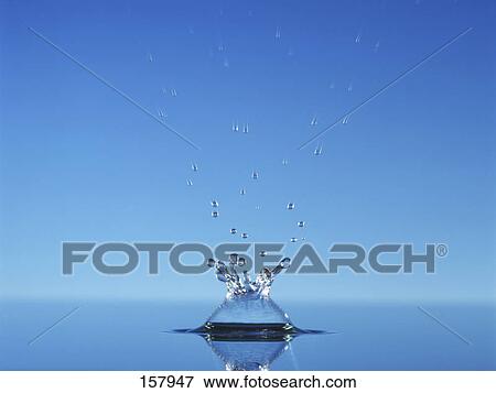 Close-up of water drop splashing on water surface View Large Photo Image Stock Photo - Close-up of water drop splashing on water surface . Fotosearch