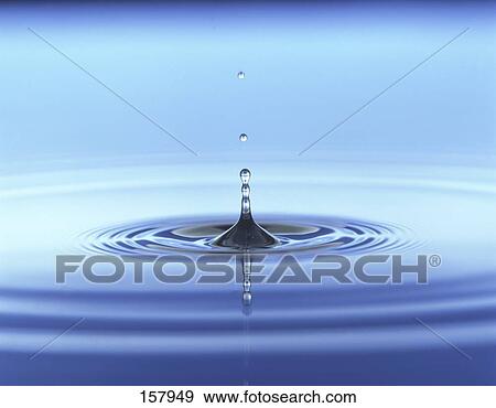 Close-up of water droplet creating ripples View Large Photo Image Stock Photo - Close-up of water droplet creating ripples . Fotosearch