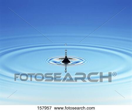 Close-up of water droplet creating ripples View Large Photo Image Stock Photo - Close-up of water droplet creating ripples . Fotosearch
