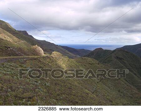 Stock Photography - Clouds in sky over mountain range, La Gomera, Canary Islands, Spain . Fotosearch