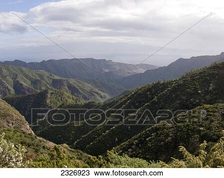 Clouds over mountain range, Cumbre ce Tajaque, La Gomera, Canary Islands, Spain View Large Photo Image Stock Image - Clouds over mountain range, Cumbre ce Tajaque, La Gomera, Canary Islands, Spain . Fotosearch
