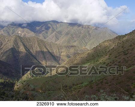 Clouds over mountain range, La Gomera, Canary Islands, Spain View Large Photo Image Stock Image - Clouds over mountain range, La Gomera, Canary Islands, Spain . Fotosearch