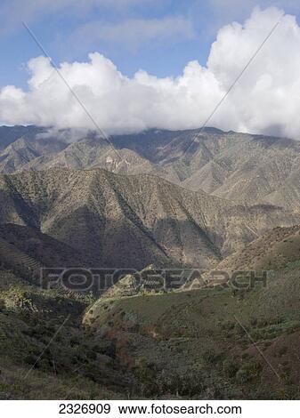 Clouds over mountain range, La Gomera, Canary Islands, Spain View Large Photo Image Stock Photo - Clouds over mountain range, La Gomera, Canary Islands, Spain . Fotosearch