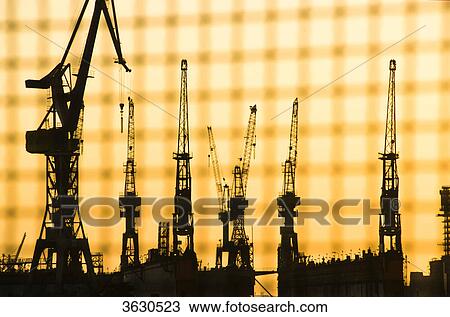 Stock Image - Cranes at Hamburg Harbor, Hamburg, Germany . Fotosearch