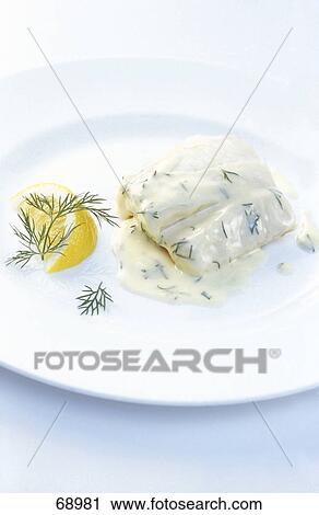 Cream sauce on fish fillets with slice of lemon on plate View Large Photo Image Stock Image - Cream sauce on fish fillets with slice of lemon on plate . Fotosearch
