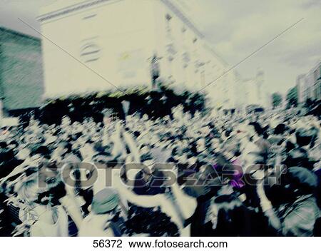 Stock Image - Crowd of people on road . Fotosearch