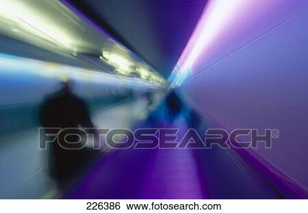 Stock Photograph - Defocused view of people on conveyor belt . Fotosearch