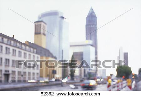 Stock Image - Defocused view of skyscrapers in city, Messeturn Tower, Frankfurt, Hesse, Germany . Fotosearch