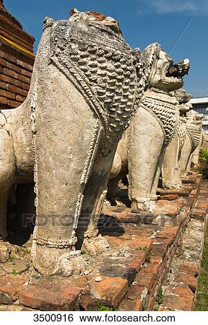 Dragon sculptures in temple ruin Wat Thammikarat, Ayuthaya, Thailand View Large Photo Image Stock Photograph - Dragon sculptures in temple ruin Wat Thammikarat, Ayuthaya, Thailand . Fotosearch
