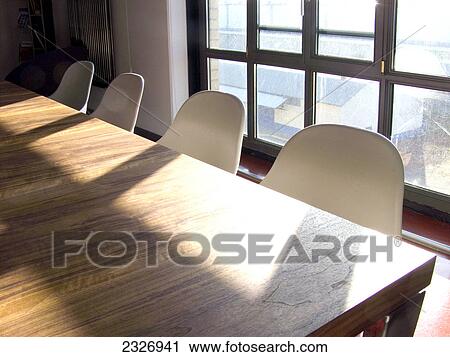Stock Image - Empty chairs and table at conference room . Fotosearch