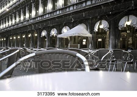 Empty pavement cafe in front of arcades, Venice, Italy View Large Photo Image Stock Photography - Empty pavement cafe in front of arcades, Venice, Italy . Fotosearch