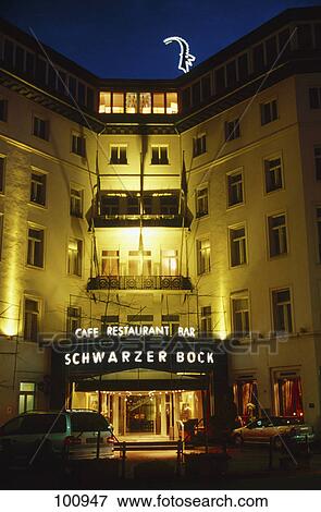 Entrance of hotel lit up at night, Wiesbaden, Hesse, Germany View Large Photo Image Stock Photo - Entrance of hotel lit up at night, Wiesbaden, Hesse, Germany . Fotosearch