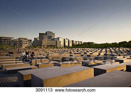 Evening mood at the Memorial to the Murdered Jews of Europe, the Holocaust memorial, in front of high-rise buildings on Potsdamer Platz, Potsdam Square, Berlin, Germany, Europe View Large Photo Image Stock Image - Evening mood at the Memorial to the Murdered Jews of Europe, the Holocaust memorial, in front of high-rise buildings on Potsdamer Platz, Potsdam Square, Berlin, Germany, Europe . Fotosearch