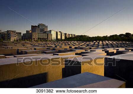 Stock Image - Evening mood at the Memorial to the Murdered Jews of Europe, the Holocaust memorial, in front of high-rise buildings on Potsdamer Platz, Potsdam Square, Berlin, Germany, Europe . Fotosearch