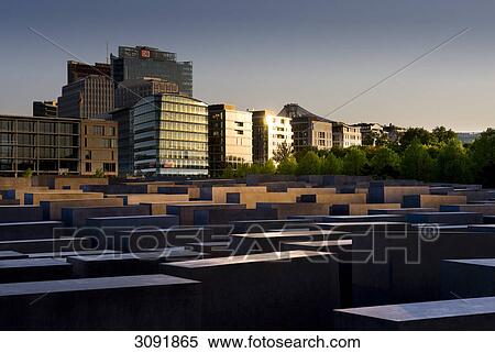 Evening mood at the Memorial to the Murdered Jews of Europe, the Holocaust memorial, in front of high-rise buildings on Potsdamer Platz, Potsdam Square, Berlin, Germany, Europe View Large Photo Image Stock Photography - Evening mood at the Memorial to the Murdered Jews of Europe, the Holocaust memorial, in front of high-rise buildings on Potsdamer Platz, Potsdam Square, Berlin, Germany, Europe . Fotosearch