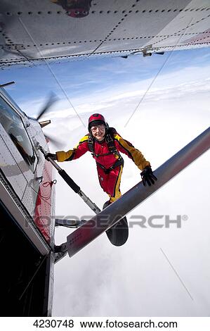 Stock Photo - Female parachute jumper, Saanen, Canton Bern, Switzerland . Fotosearch