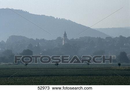 Field with bell tower in background, Germany View Large Photo Image Stock Image - Field with bell tower in background, Germany . Fotosearch