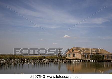 Stock Image - Fish traps in river, Valli Di Comacchio, Emilia-Romagna, Italy . Fotosearch