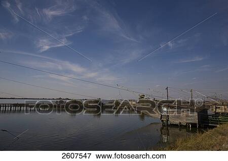 Stock Photo - Fish traps in river, Valli Di Comacchio, Emilia-Romagna, Italy . Fotosearch