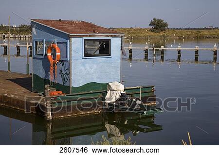 Stock Photograph - Fish traps in river, Valli Di Comacchio, Emilia-Romagna, Italy . Fotosearch