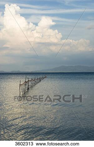 Stock Image - Fishing net in the ocean near Ko Ngai Island, Thailand . Fotosearch