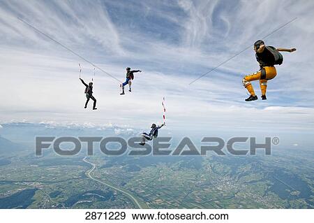 Four parachutists doing free fall, Switzerland View Large Photo Image Stock Photo - Four parachutists doing free fall, Switzerland . Fotosearch