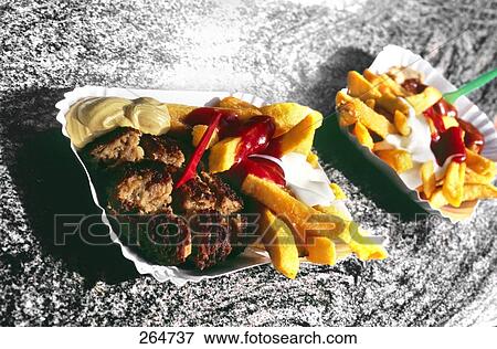 French fries and ketchup on paper plates View Large Photo Image Stock Photo - French fries and ketchup on paper plates . Fotosearch
