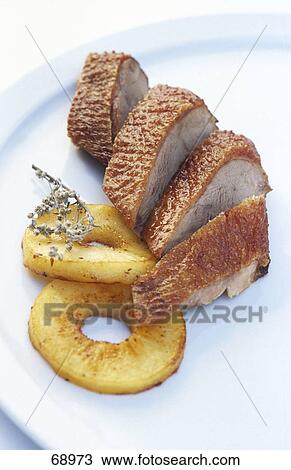 Stock Image - fried sliced duck, close-up . Fotosearch