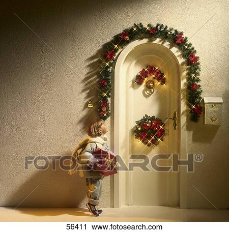 Girl standing with gift at door of house View Large Photo Image Stock Image - Girl standing with gift at door of house . Fotosearch