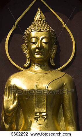 Stock Image - Golden Buddha statue, Temple Watdokkham, Chiang Mai, Thailand . Fotosearch