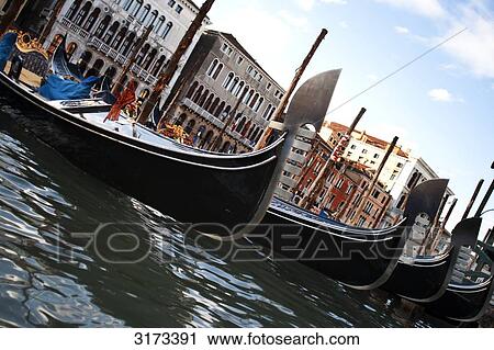 Stock Image - Gondolas at the pier, Venice, Italy, slanted view . Fotosearch
